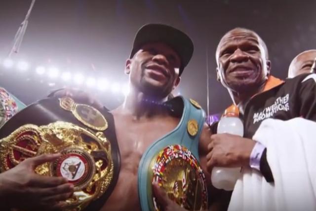 Mayweather vs Pacquiao - Floyd Mayweather victorious with belts