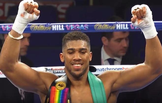 Anthony Joshua celebrates victory over Joseph Parker